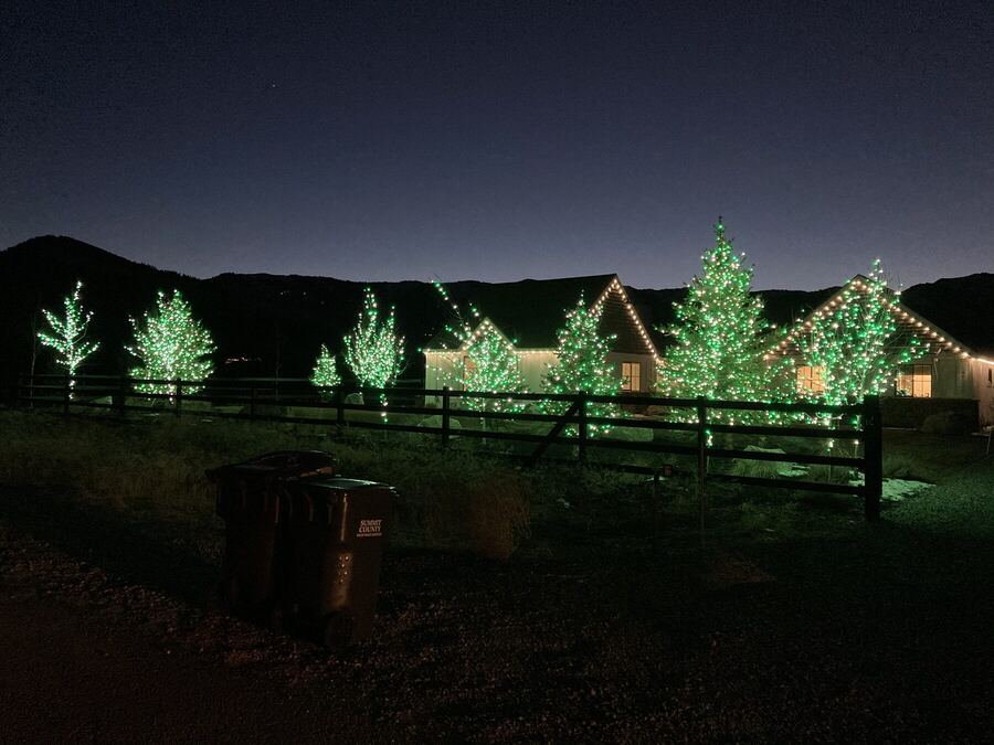 The ranch at dusk with the mountains behind